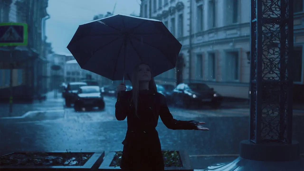 Woman with an umbrella and its raining
